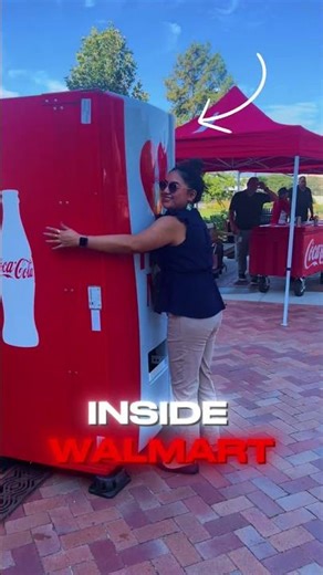 This coca-cola machine requires hugs for drinks!