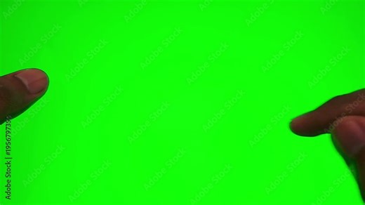 Asian man's hand scrolling, pausing, and double-tapping to like a post on a green screen tablet or smartphone. Aesthetic indoor room setting for social media, app interface, and digital technology.