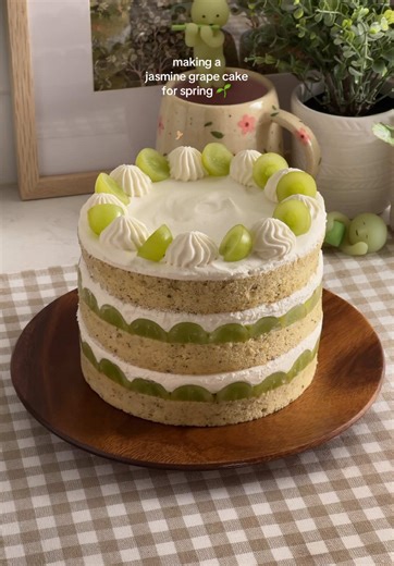 jasmine grape cake 🌱 with layers of jasmine tea-infused chiffon cake, fresh green grapes (or muscat!), and whipped cream. made in a milk bar style naked cake with enough cake scraps leftover to make yourself a cake box ☺️ recipe linked in my bio or search “jasmine grape cake” on teakandthyme.com ☁️ #jasminetea #chiffoncake #grapecake #baking