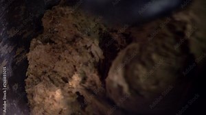 focus on spiral of industrial bread machine working the dough