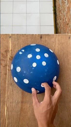 Experiment: Dropping blue, yellow and pink polka dot water balloons from a height