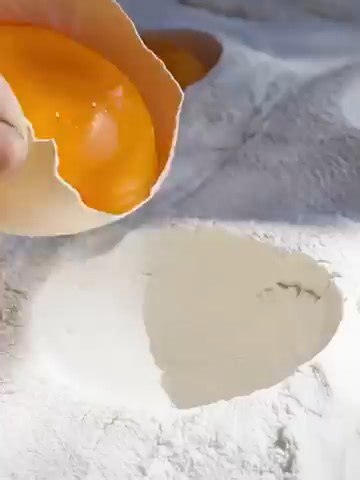 Handmade Chinese Lotus Pastry | Full Traditional Making Process The Lotus Pastry is a traditional Chinese dessert known for its layered, flower-like shape and fragrant filling. The process begins by preparing the filling, usually sweet bean paste or salted egg-yolk lotus paste. Next, two types of dough are made: the water-oil dough and the fat-based dough (oil pastry), each kneaded and rested separately. The water-oil dough is rolled out and wrapped around the oil pastry. It is then folded and r