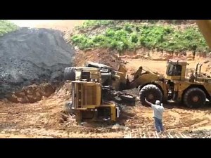 Cat scraper rollover