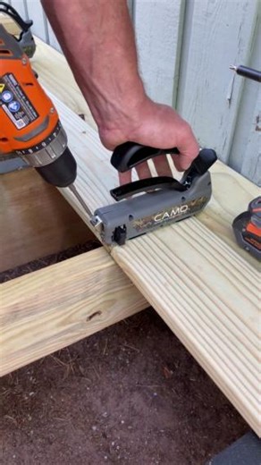 The CAMO MARKSMAN Pro tool makes deck building easy—whether you're a pro or tackling your first project. It spaces boards and guides two CAMO Edge Screws into the sides, delivering a smooth, fastener-free finish every time 🔥 #CAMOFasteners #DeckBuild #Tools #HiddenFasteners | CAMO Fasteners