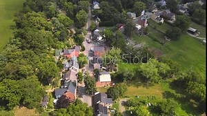 Historic Village of Waterford, Virginia, Aerial Drone Footage. Old houses among green trees.