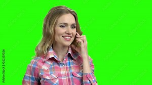 Woman using transparent phone on green screen. Digital technology development. Latest technology innovation.