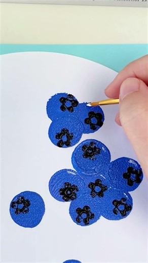 Create beautiful blueberry prints using sponge stamps and straws. It's so easy to learn.