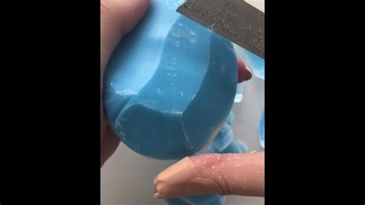 Pastel blue and white bar soap shredding