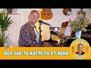 Der sad to katte på et bord I Syng med Sigurd I Sigurd Barrett
