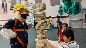 Special guests appear at fun-filled summer fair for low-income families