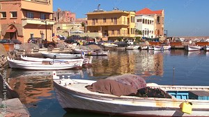 The fishing village of Tyre, Lebanon with boats in foreground.