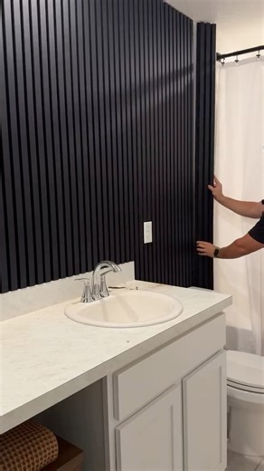 This bathroom 🔥 is a fan favorite and for good reason! Love the dark, moody vibe I created for this space 🤙🏽 #bathroom #bathroomremodeling #slatwall #wallpanelling #diy #homeimprovement #homeideas | Home with Mike