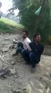 ONE SCREAMS IN AGONY THE OTHER TAKES HIS BEATING LIKE A MAN