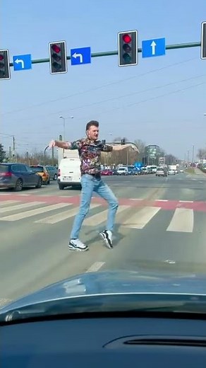 Guy Moonwalks Over Crosswalk Sign as Traffic Stops at Red Signal - 1187002-1
