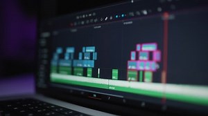 clip-1099907613-human-editor-uses-laptop-creatively-create-video