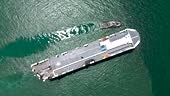 Top view of a cargo ship exporting goods across the continent.