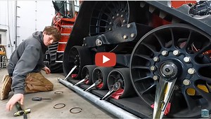 Larson Farms - Farming In Minnesota Is Fun!! The tracks get some new oil.....