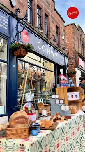 2.3K views · 351 reactions | The Conwy Honey Fair! | Y Ffair Mêl Conwy!  Today the high street comes alive in Conwy, with a 700 year old annual tradition. Outside our Baked Goods & General Store, you’ll find Sïan with free tasters on the stall outside to enjoy, including our Hot Honey with @snowdoniahoney. Our Store & Restaurant are open as usual too - it’s great to see the street buzzing with life! | Dylan's | Facebook