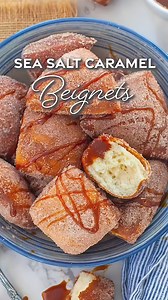 The best donuts ever!!! Soft & fluffy beignets coated in cinnamon sugar, served with salted caramel! Beyond delicious and super easy to make! Ingredients: For Yeast Dough: 1 cup whole milk 1 tbsp dry active yeast 1/2 cup unsalted butter, melted 1 large egg, plus 1 egg yolk 1/2 cup white granulated sugar 2 tsp vanilla extract 1 tsp salt 4 cups all-purpose flour, divided For Sugar Coating: 1 cup white granulated sugar 2 tsp ground cinnamon For Salted Caramel Sauce: 1 cup white granulated sugar 1/4