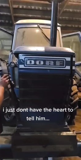 Old Ford Tractor Restoration in a Dim Garage