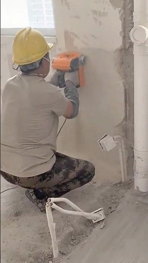 Grinding wall surface using electric handheld concrete grinder tool