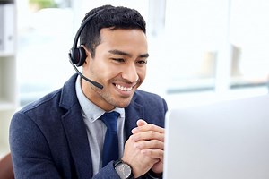 Call center insurance agent and business man consulting on video call doing telemarketing with a smile in an office computer contact us and customer service employee talking support or helping | Premium Photo