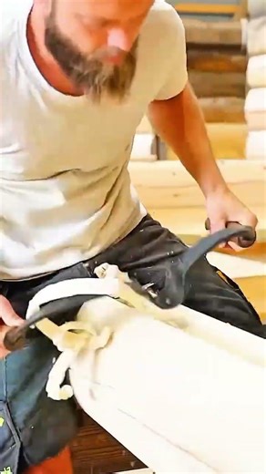 hollowing out wood logs with a curved drawknife to create traditional containers
