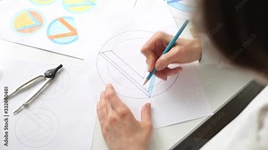 Graphic designer draws a sketch of a brand logo.