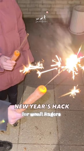 Maria Appelt | Child development expert on Instagram: "Stick the sparkler into a carrot if your child loves sparklers on New Year’s Eve but doesn’t love the feeling of tiny sparks on their hands. Happy New Year! 🎉 With love, Maria ♥️"