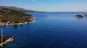Flying drone over one of the most beautiful beaches of Albania, Ksamil Beach, Albania.