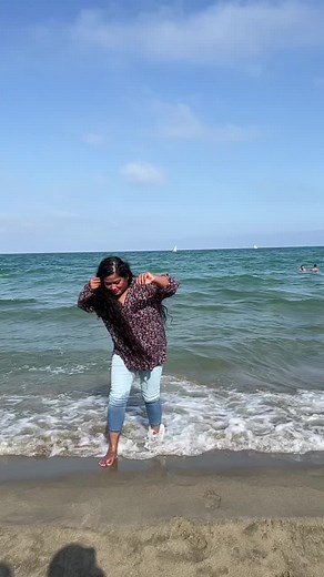 Woman Enjoying Peaceful Day at the Ocean