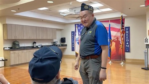 Veteran volunteers at VA nursing home, providing games, activities for patients