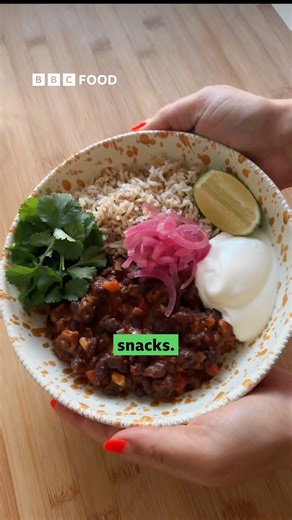 This baked tofu chilli bowl is the perfect warming dinner to interrupt the festive snack chaos. https://www.bbc.co.uk/food/recipes/baked_tofu_and_black_61334 | BBC Food