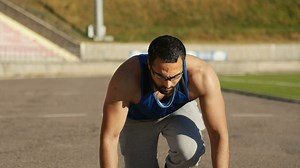 Runner summons motivation at start of race - Free Stock Video