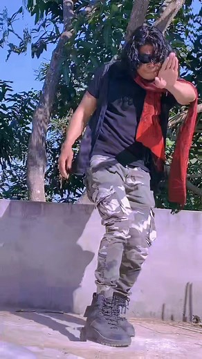 Dynamic Outdoor Dance Moves in Camouflage Attire
