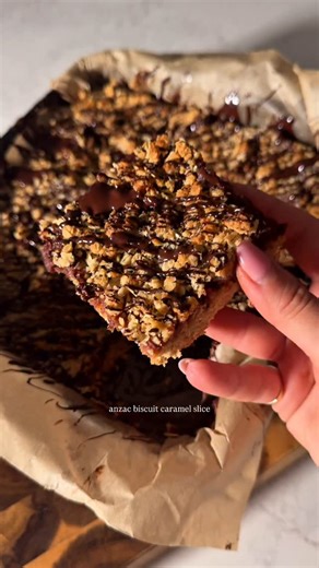 Amal Wakim on Instagram: "This isn’t your grandma’s anzac biscuit… but she’d approve 🫶🏼 Makes 12 squares ~286 cals per piece Base & crumble: 200g rolled oats 125g plain flour 40g desiccated coconut ½ tsp baking soda ½ tsp sea salt 60g brown stevia 100g light butter, melted 80g honey 1 tsp vanilla extract Date caramel: 450g Medjool dates, pitted 1 tsp baking soda Boiling water to soak 1 tsp vanilla extract 1 tbsp almond butter (optional) Pinch of salt 2-4 tbsp soaking water to blend Method: 1. 