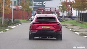 Two green Lamborghinis driving together on public roads