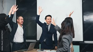 Business people join putting hands as team during their meeting, Stack of hands coming together of teamwork, Business group winning successful company achieving goals with determined staff
