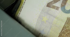 Euro banknotes of different denominations during counting in the counting machine. The currency of the European Union. Close-up
