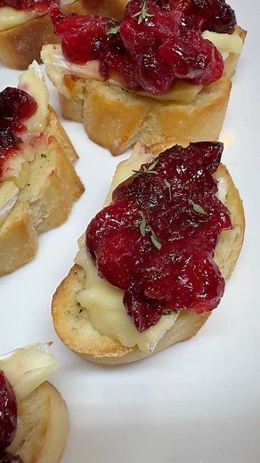 Day 4 of Christmas Recipes with Spilling the Sweet Tea are these roasted cranberries brie crostinis. These are so easy to make and are the perfect appetizer for your upcoming holiday party! #cranberries #briecheese #crostini #holidayappetizers #fingerfoodideas | Spilling the Sweet Tea