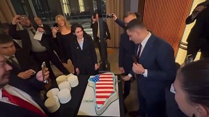 In which MAGA congresswoman Anna Paulina Luna cuts a Greenland-shaped American flag cake with George Simion, a far-Right Romanian fascist elected official who is literally a Putin puppet. Russia is very happy with what Trump is doing. | The Liberal Agenda