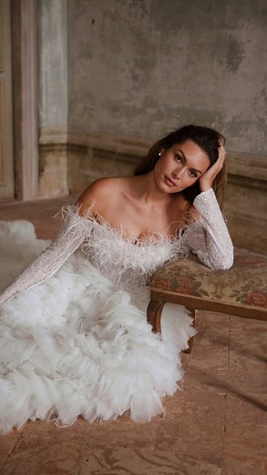 Milla Nova™ on Instagram: "When opulence and bizarreness intertwine  With a plush feather-trimmed neckline and voluminous frothy layers of feathered and sequined cascading tulle skirt — Gustavia is the definition of statement gown. #MillaNova #RoyalCollection #couture"