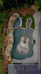 Insane Pool with Guitar Shaped Island & Natural Rock Waterfalls #insanepools #lucaslagoons #pool #poolbuilders #backyard #guitarlife | Lucas Lagoons