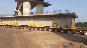 80K views · 1.7K reactions | Catch a glimpse of Transportation of 350 ton, 32 metre long Pre-stressed concrete Box Girder by remote-controlled vehicle having 24 axles & 160 tyres for the launch of Viaduct - 92 on Western DFC’s Rewari- Dadri section. | Ministry of Railways, Government of India | Facebook