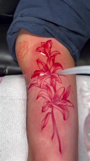 Red Floral Tattoo for Inner Bicep by Female Artist