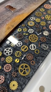 Would love to hear your thoughts on thisthis steampunk inspired serving board! - Here's what we used: WOOD: Live Edge Walnut FORM: www.EmpireMolds.com 10" by 18" Original EPOXY: Squidpoxy Clear Fast PIGMENT: www.BeaverDustPigments.com "Gun Metal Grey" GEARS: Steampunk Gears (Coming Soon to our website) FINISH: Tover L'Olio - Shop these supplies and more at www.JeffMackSupply.com We ship to 66 countries and offer free shipping to Canada and USA when you spend over $240USD ($300CAD) - #Steampunk #