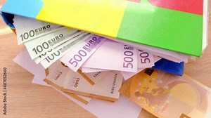 office folders close-up, 100, 50, 500 euro banknotes, concept of filling out tax return, paying taxes, Corporate business income, expenses, maintaining household expenses, Gearing Up for Startups