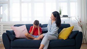Mother supporting son who has problems in school, victim of bullying, depression