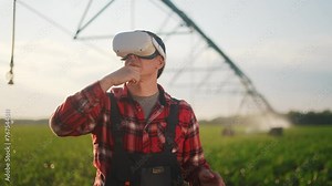 agriculture virtual reality. a farmer in virtual reality glasses controls a machine to irrigate corn field. agriculture virtual reality concept. a farmer business vr in works in field with corn