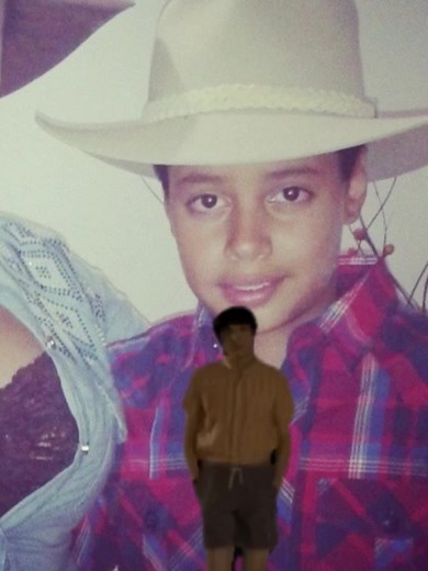 Person in Cowboy Hat Performs Sign Language Outdoors